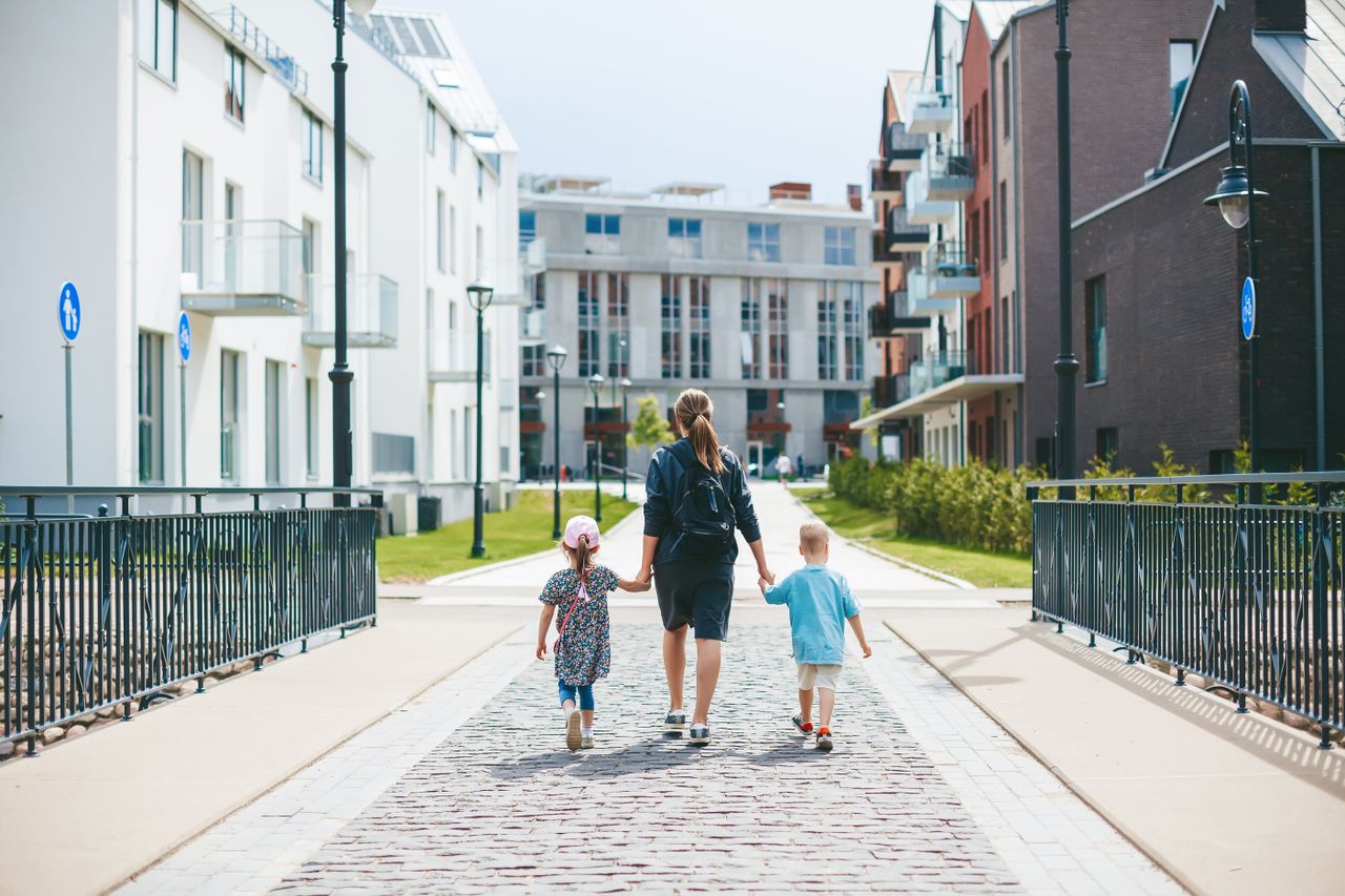 mother-two-her-kids-boy-girl-holding-hands-while-going-kindergarten-morning